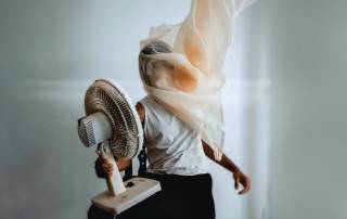 person holding fan